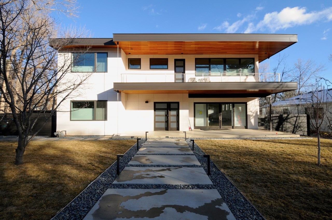 Rear patio and balcony of a completed home addition in Boulder, CO