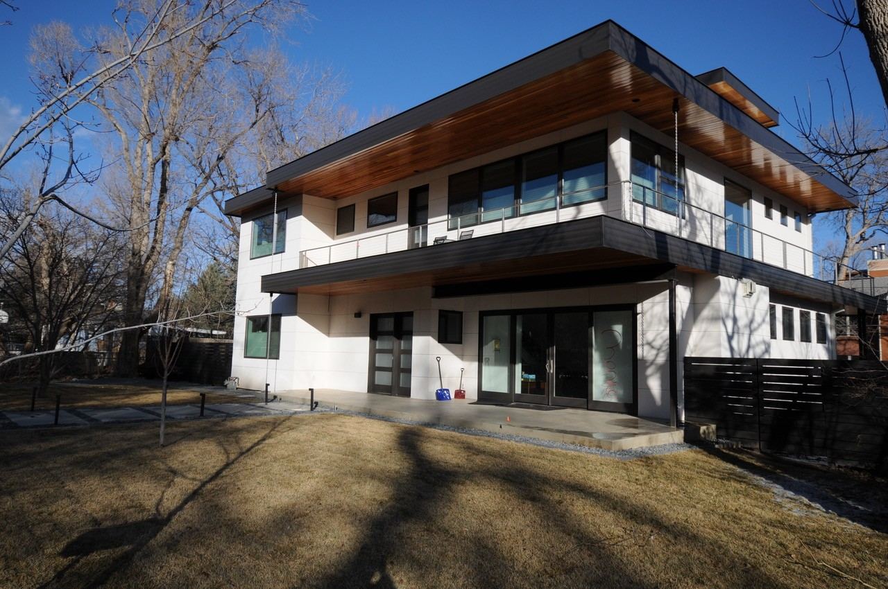 Rear exterior of a second-story addition in Boulder, CO with wraparound balcony